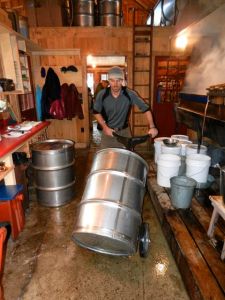 Ross fills and moves drums.